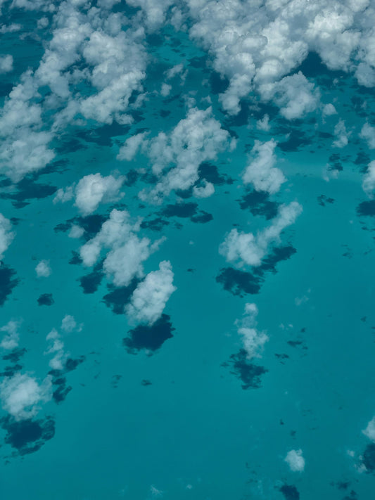 White Clouds over a Blue Sea