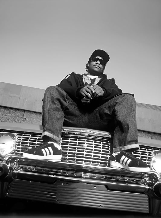 Easy E from NWA chilling on his 1964 Chevy Impala. (1994)