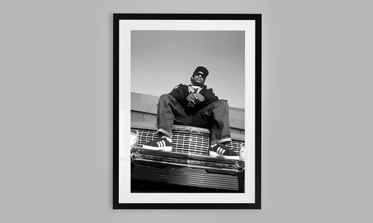 Easy E from NWA chilling on his 1964 Chevy Impala. (1994)