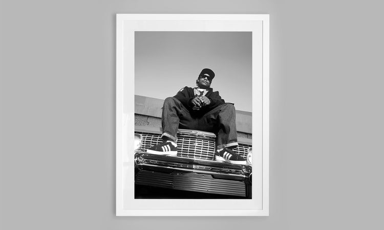 Easy E from NWA chilling on his 1964 Chevy Impala. (1994)