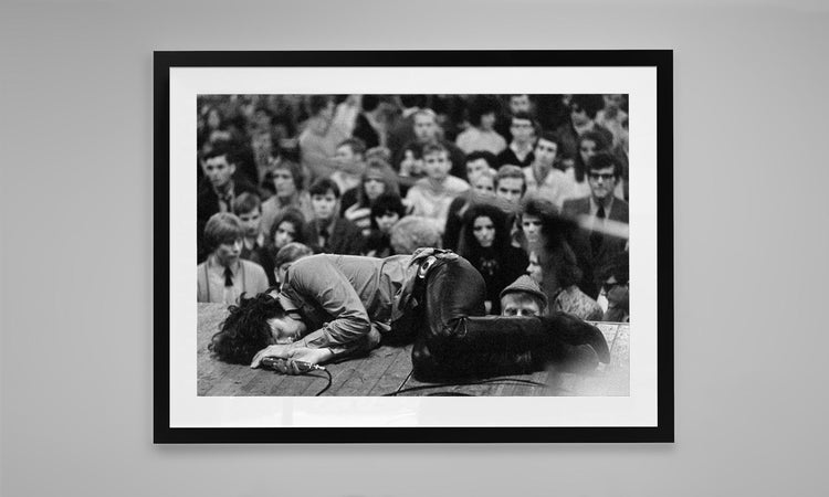 Jim Morrison laying on stage during a performance of The Doors in Frankfurt, Germany. (1968)